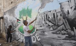 BM İklim Zirvesi sürerken, Gazze'de İsrail'in uyguladığı ekokırım duvar resmiyle anlatıldı
